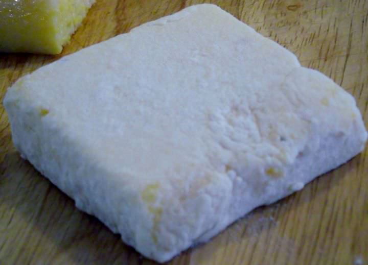 Polenta square properly dredged in flour.