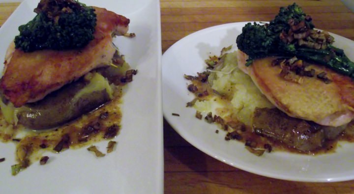 Chicken under a brick, smashed potato, and broccoli rabe on a plate.