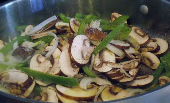 Sauteing mushrooms, onions, and peppers.
