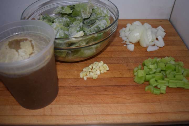 Ingredients to start the soup: broccoli stems, onion, celery, garlic, and stock.