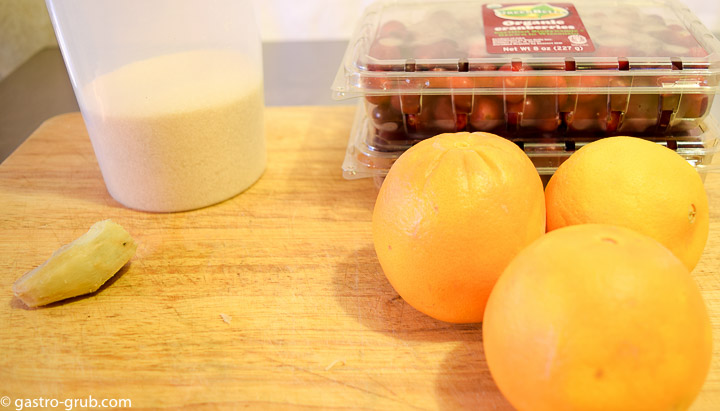 Ingredients for my gourmet cranberry sauce: cranberries, sugar, ginger, and oranges.