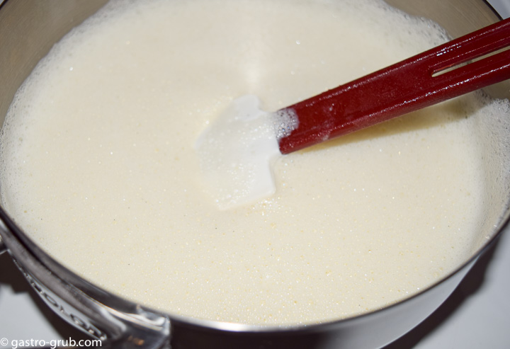 With the mixer running slowly stream the hot milk into the egg mixture.