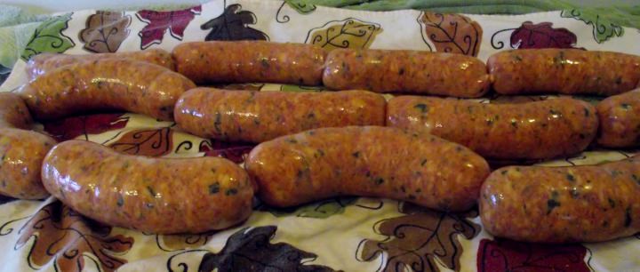 Sausage links resting on a kitchen towel.
