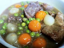 Lamb stew with peas, pearl onions and parisienne carrots.
