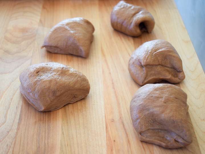 Cocoa dough divided into five pieces.