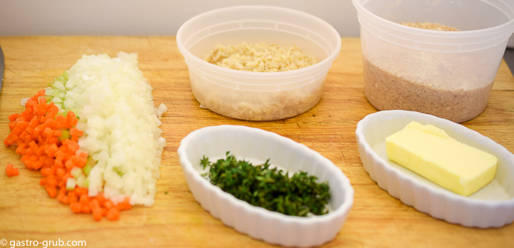 Ingredients for stuffed meatloaf: celery, carrot, onion, thyme, butter, brown rice, and breadcrumbs.