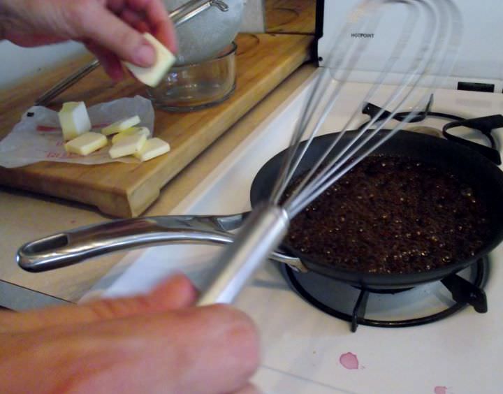 Emulsifying butter into a pan sauce.