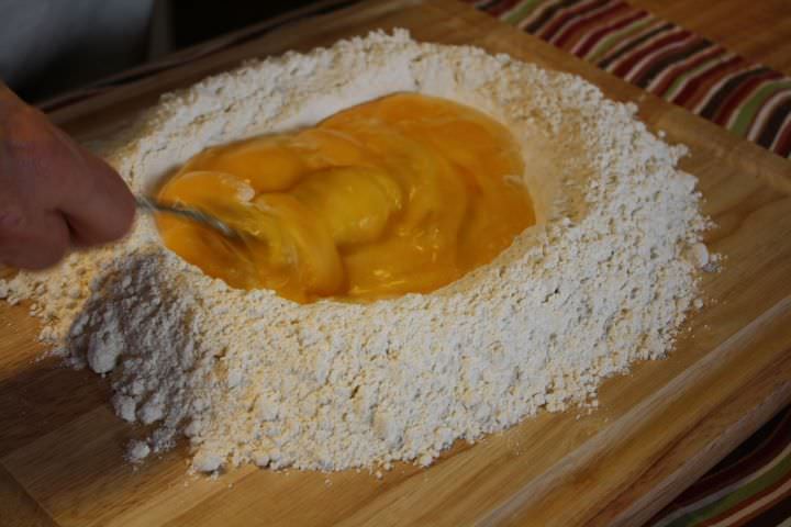 scrambling eggs in a flour well