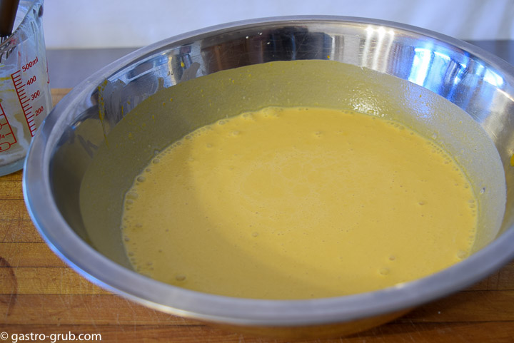 Mixing the pumpkin, cream, and vanilla for the pie filling.