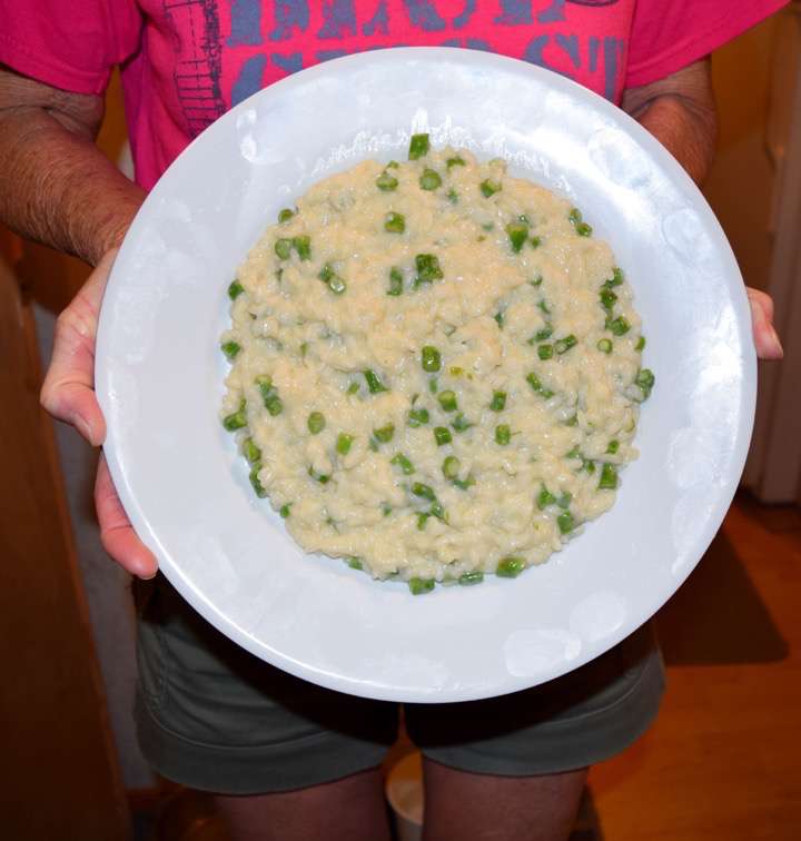 Risotto on a plate, held vertically.