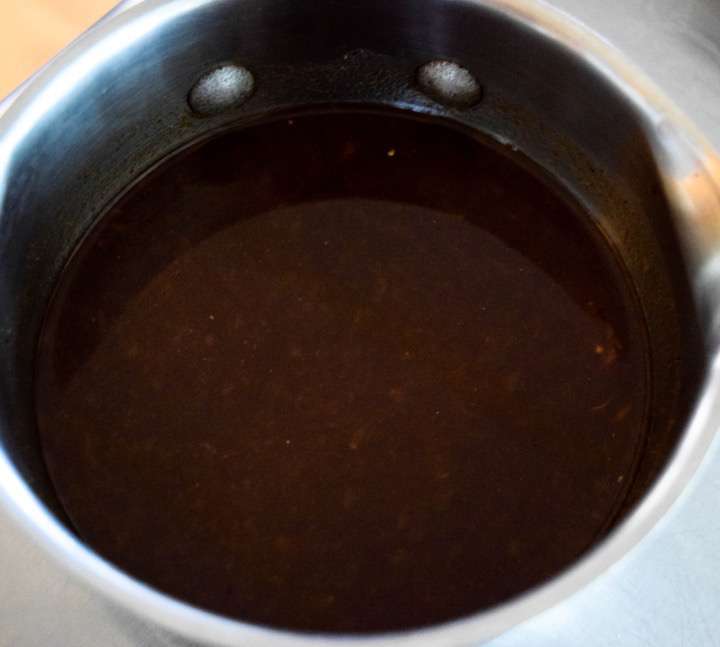 Duck glaze in a sauce pan.
