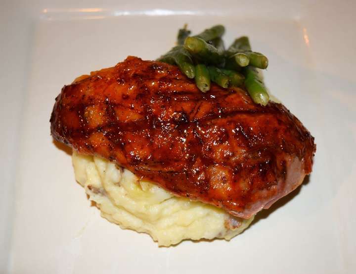 Roast duck breast, mashed potatoes, and green beans.