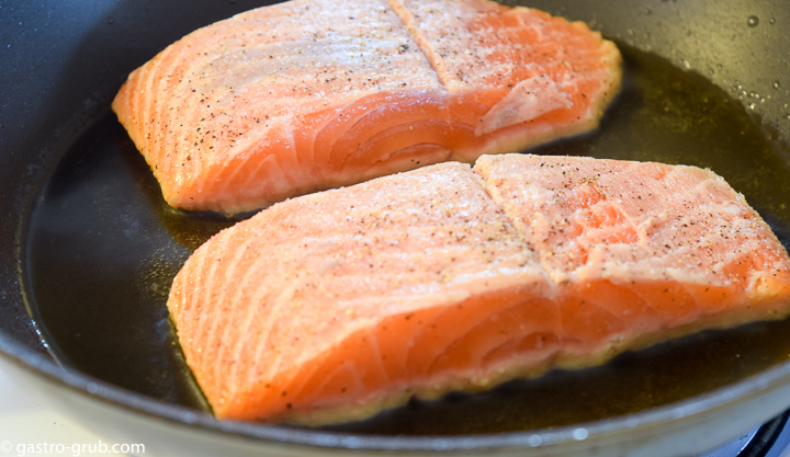 Searing salmon.