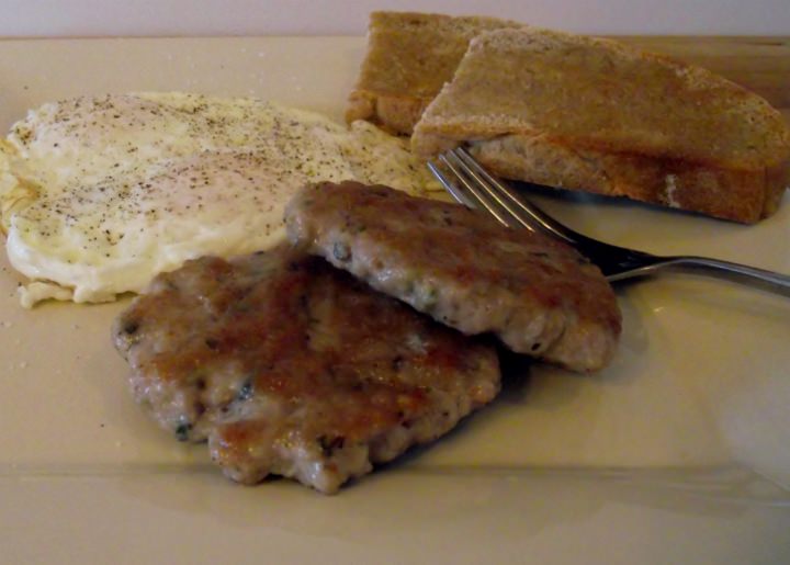 Homemade breakfast sausage, fried eggs, and toast.