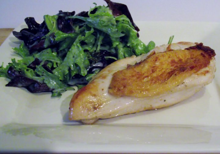 Seared, baked chicken and a green salad.