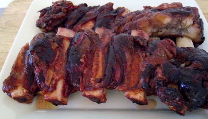 Smoked beef ribs on a plate.