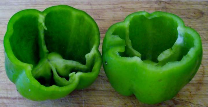 Bell peppers with tops cut off.