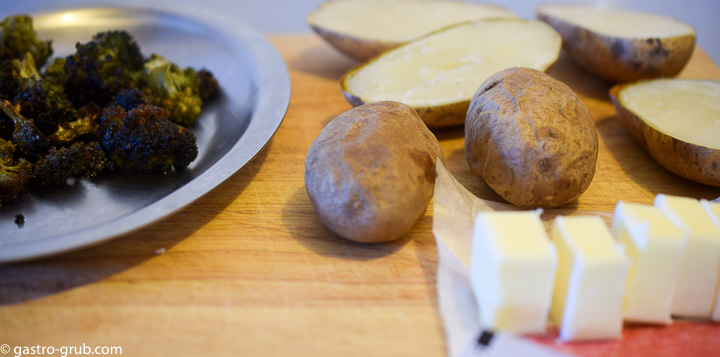 Ingredients for twice baked potatoes: baked potatoes, roasted broccoli, and butter.