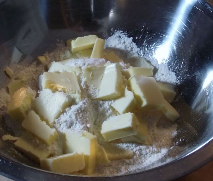 Butter and flour in a bowl for pie crust.