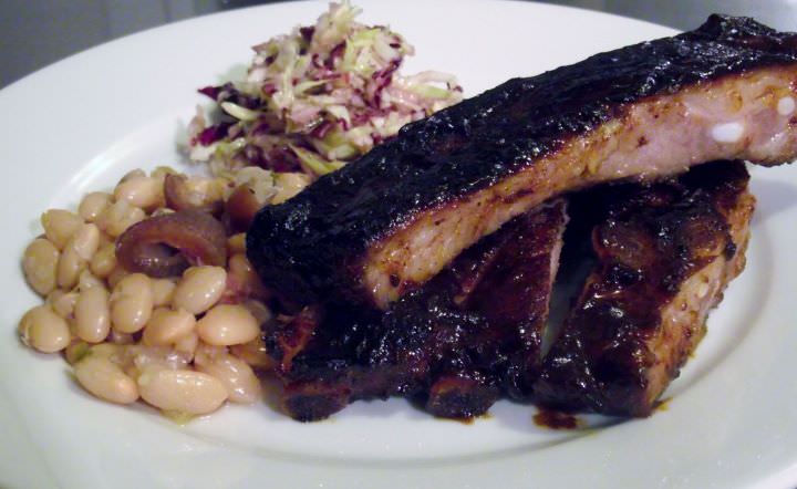 Barbecue pork ribs, baked beans, and cole slaw.