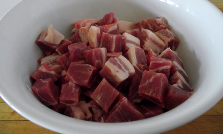 Cubed pork butt in a bowl.