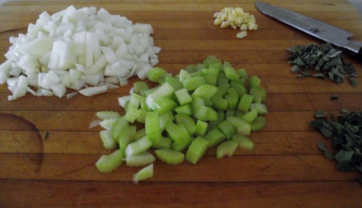 The aromatic ingredients: onions, celery, garlic, oregano, and sage.