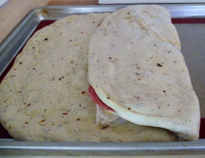 Folding the loaf into an envelope.