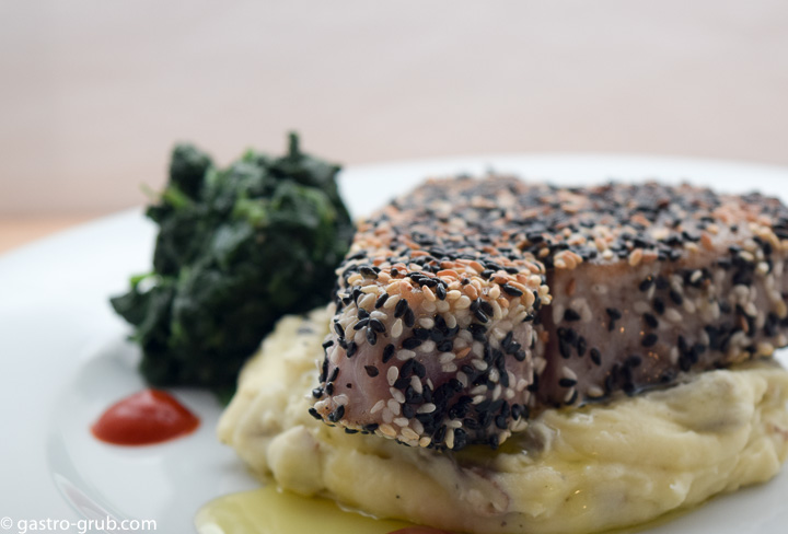 Sesame crusted ahi with wasabi mashed potatoes and sautéed spinach.