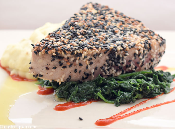 Sesame crusted ahi with wasabi mashed potatoes and sautéed spinach.