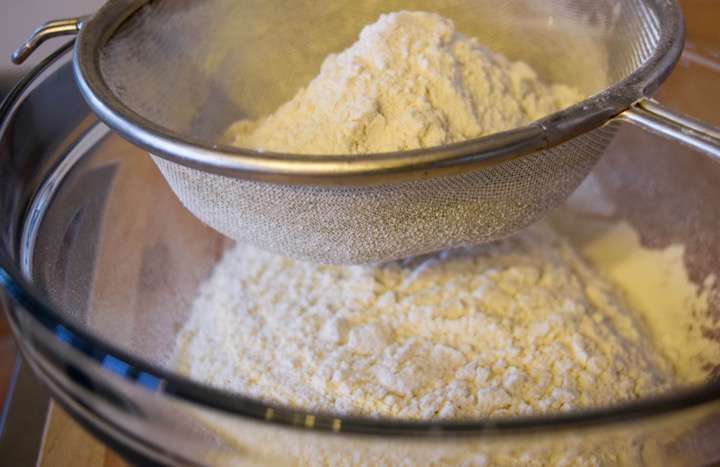 Sifting the flour and baking powder together.