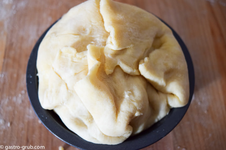 Folding the pastry over the top.