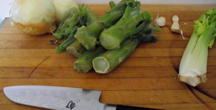 Ingredients for asparagus soup: onions, celery, garlic, and broccoli stems.