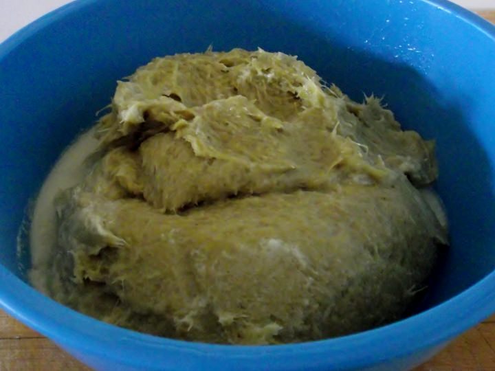 The fibrous pulp leftover after straining.
