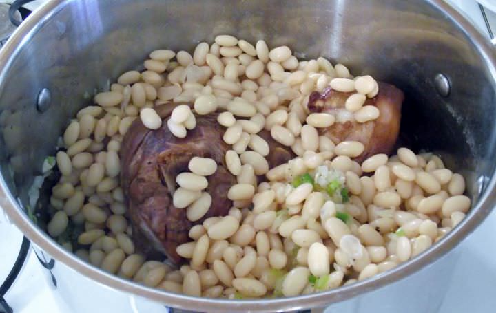 Beans, ham hocks, celery, onion, peppers, and garlic in a stock pot.