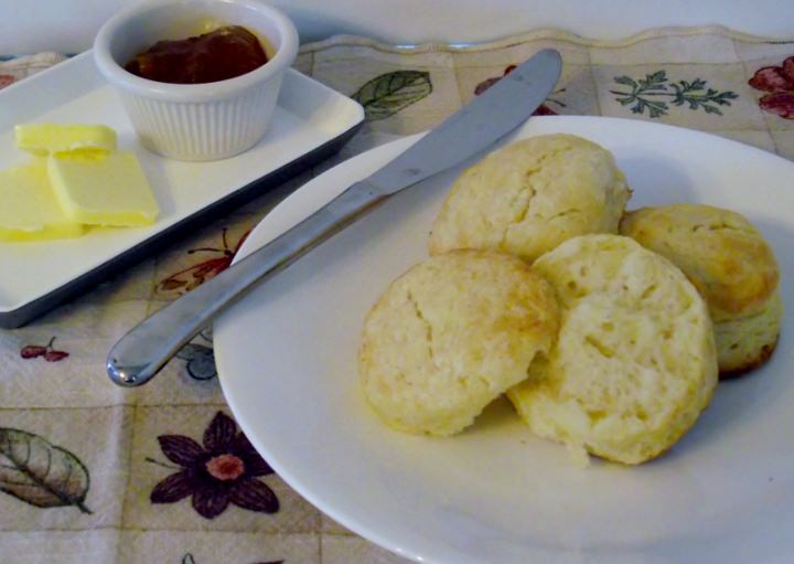 Buttermilk biscuits, apricot jam, and butter.