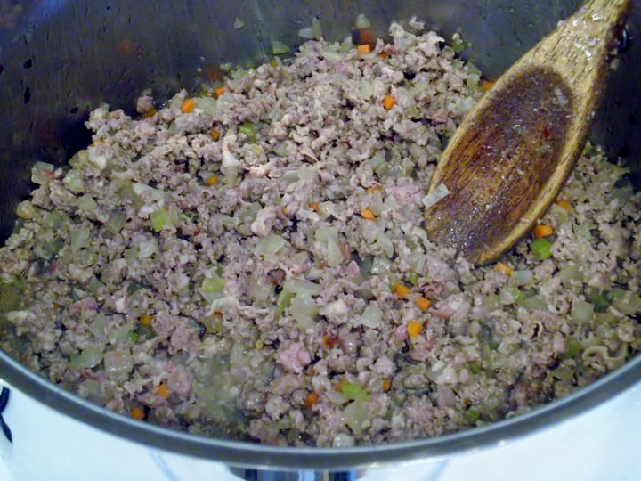 Browning the meat with the soffrito and pancetta.