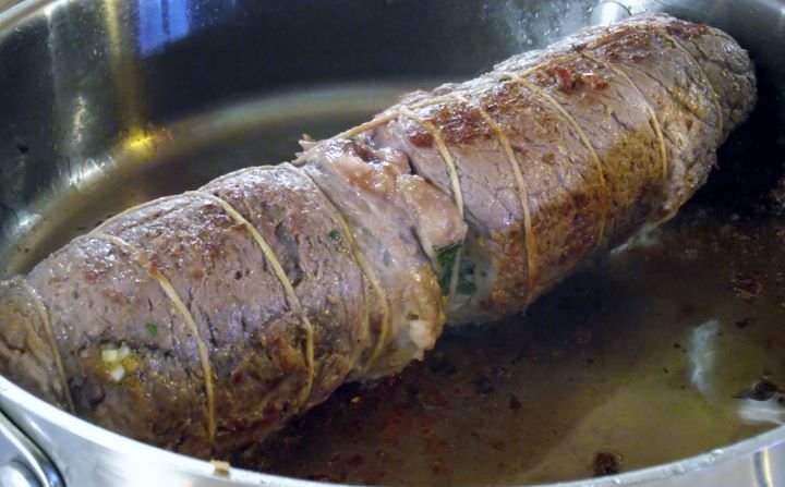 Browning the braciole in a saute pan.