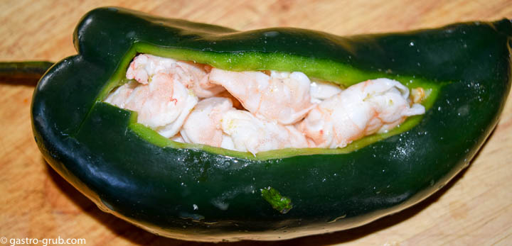 Stuffing the top half of the chili with shrimp ceviche.