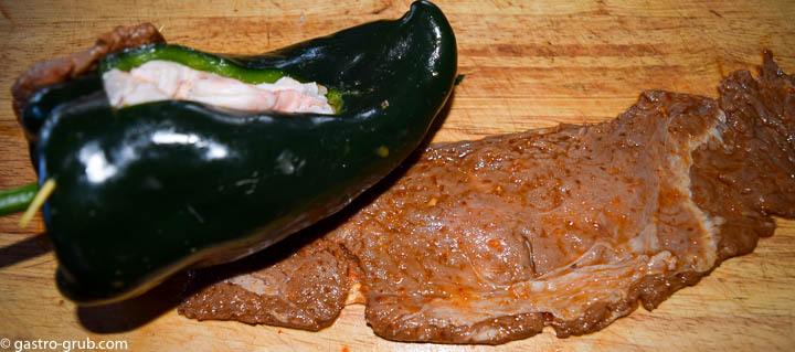 Wrapping the flank steak around the chili.