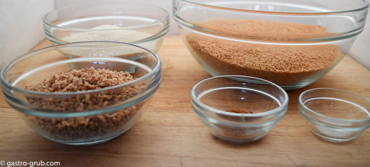 Ingredients for graham cracker crust: chopped almonds, graham cracker crumbs, sugar, cinnamon, and salt.