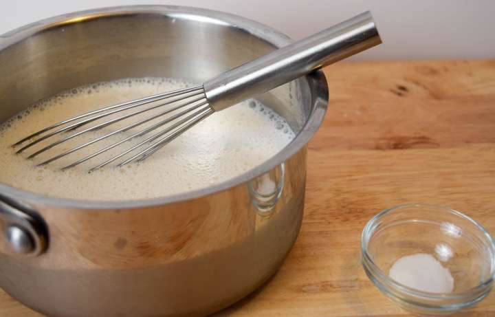 Combine the milk, sugar, and vanilla bean paste in a 2-quart saucepan.
