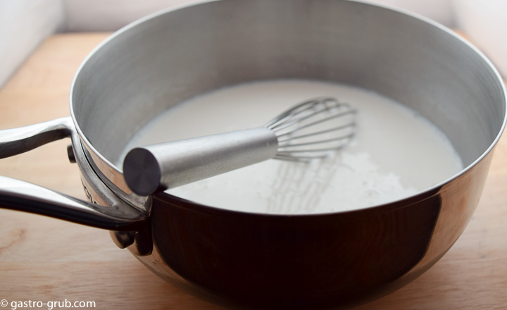 In a 21/2-quart saucier combine the remaining sugar, milk, vanilla and salt. Bring to a boil over medium heat.