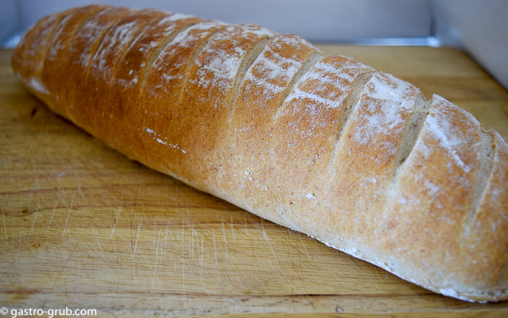 Country baguette on a cutting board.