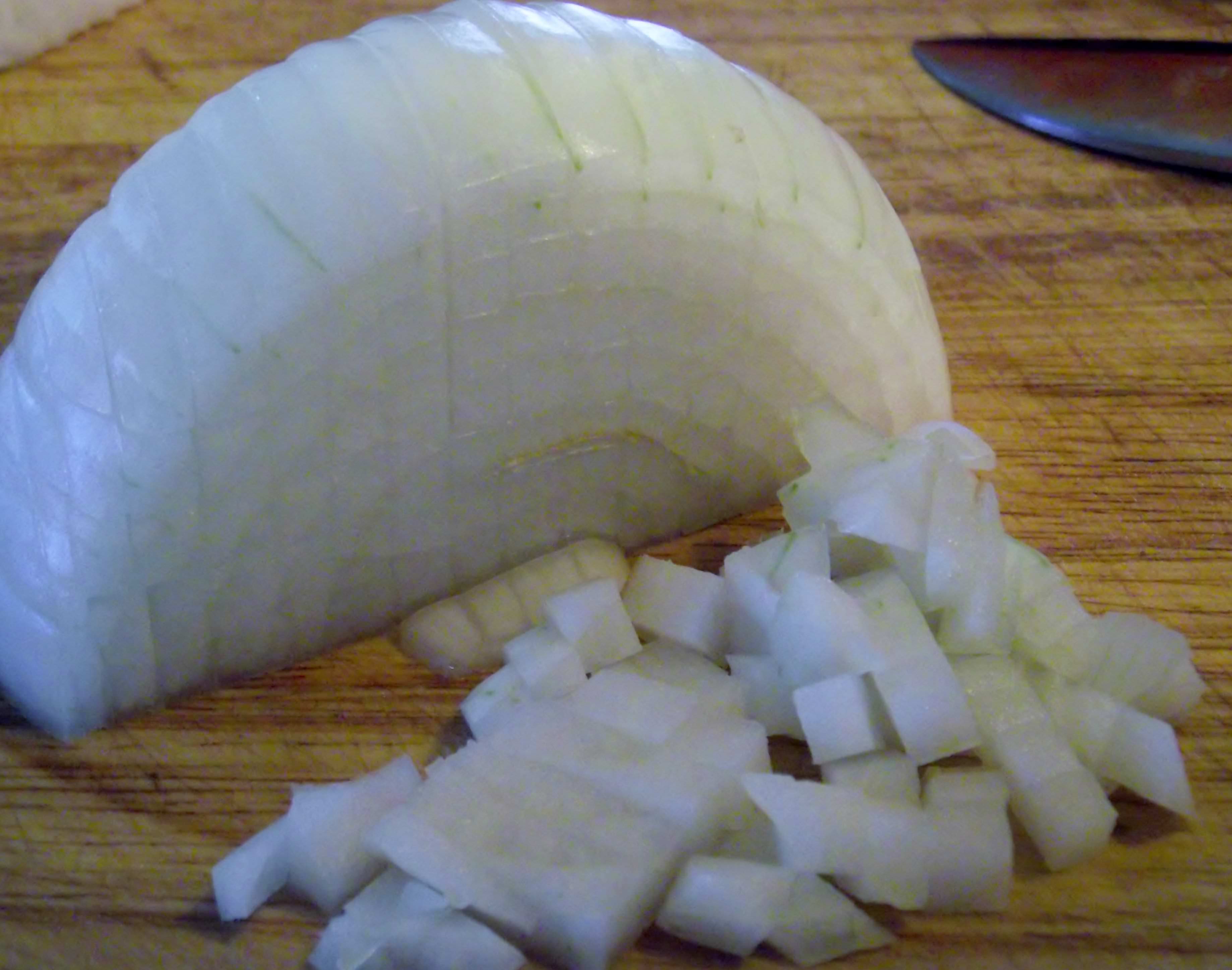 Slice the onion parallel to its equator.