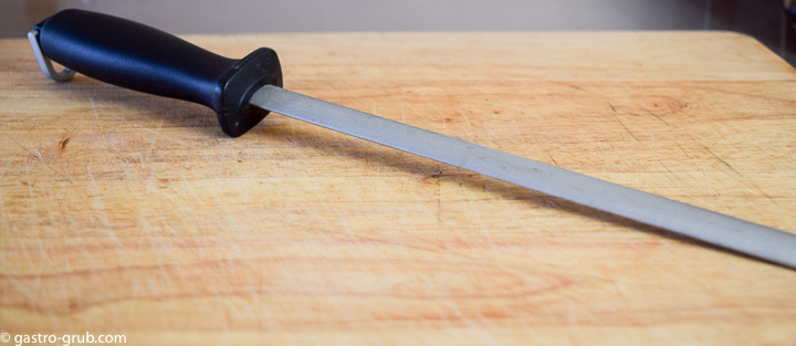 Diamond steel on a cutting board.