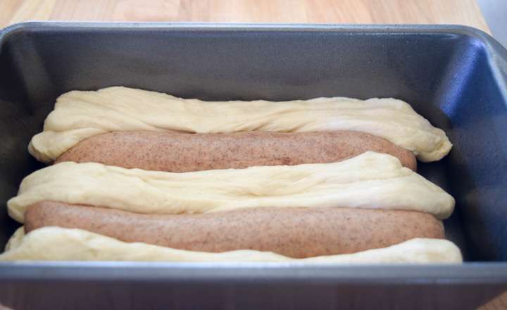 Dough layered into a bread pan.