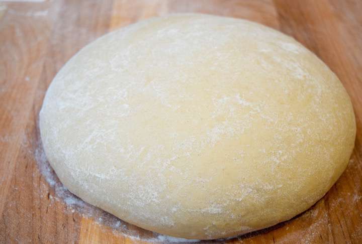 Bread dough on a pastry board.