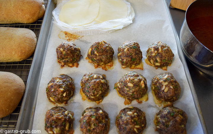 Ingredients for meatball sub recipe: Italian bread, olive oil, meatballs, provolone, marinara, and Parmigiano Reggiano.
