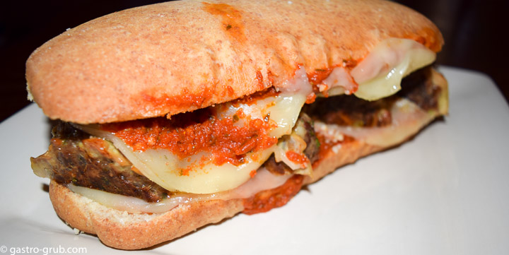 Meatball sub on a plate.