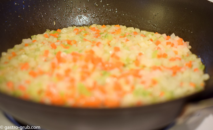 Celery, carrot and onion in a saute pan.